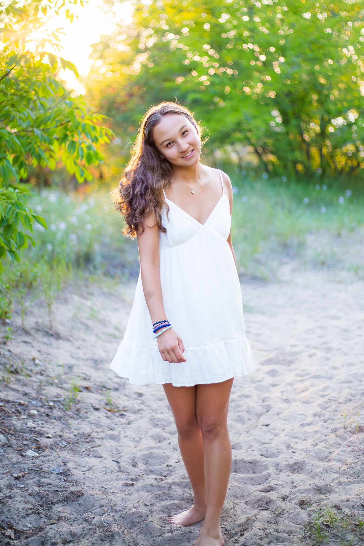 portrait of young woman in white dress at Gilson beach